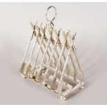 A PLATED TOAST RACK with seven pairs of oars, on ball feet. 6ins.