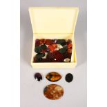 A BOX OF SEMI PRECIOUS STONES.