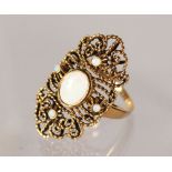 A 9CT GOLD FILIGREE OPAL SET RING.