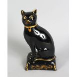 AN EARLY 19TH CENTURY ENGLISH POTTERY BLACK FIGURE OF A SEATED CAT, CIRCA. 1830, on a gilt decorated