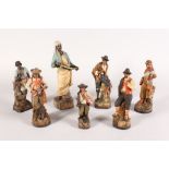 A SET OF SEVEN GERMAN OR AUSTRIAN TERRACOTTA POTTERY FIGURES, an Arab man carrying a sword, 10.