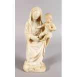 AN EARLY ALABASTER CARVING OF THE MADONNA AND CHILD. 13ins high.