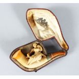 A MEERSCHAUM PIPE, young lady in a leather case.