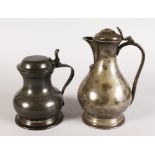 AN 18TH CENTURY PEWTER LIDDED TANKARD and A WINE JUG (2).