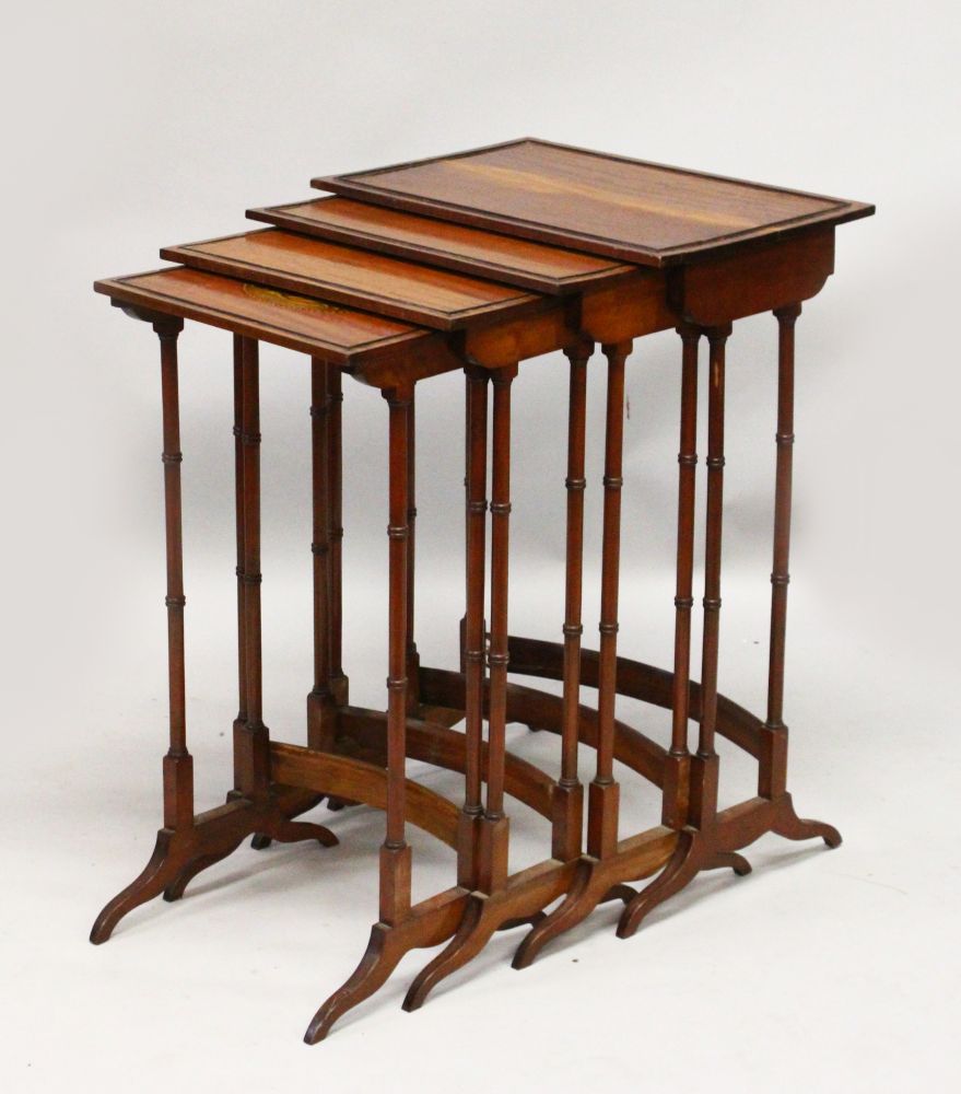 A REGENCY STYLE MAHOGANY "QUARTETTO", each with ebony inlay and turned supports, the smallest