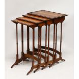 A REGENCY STYLE MAHOGANY "QUARTETTO", each with ebony inlay and turned supports, the smallest