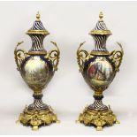 A LARGE PAIR OF SEVRES STYLE PORCELAIN VASES WITH ORNATE ORMOLU MOUNTS, the bodies decorated with