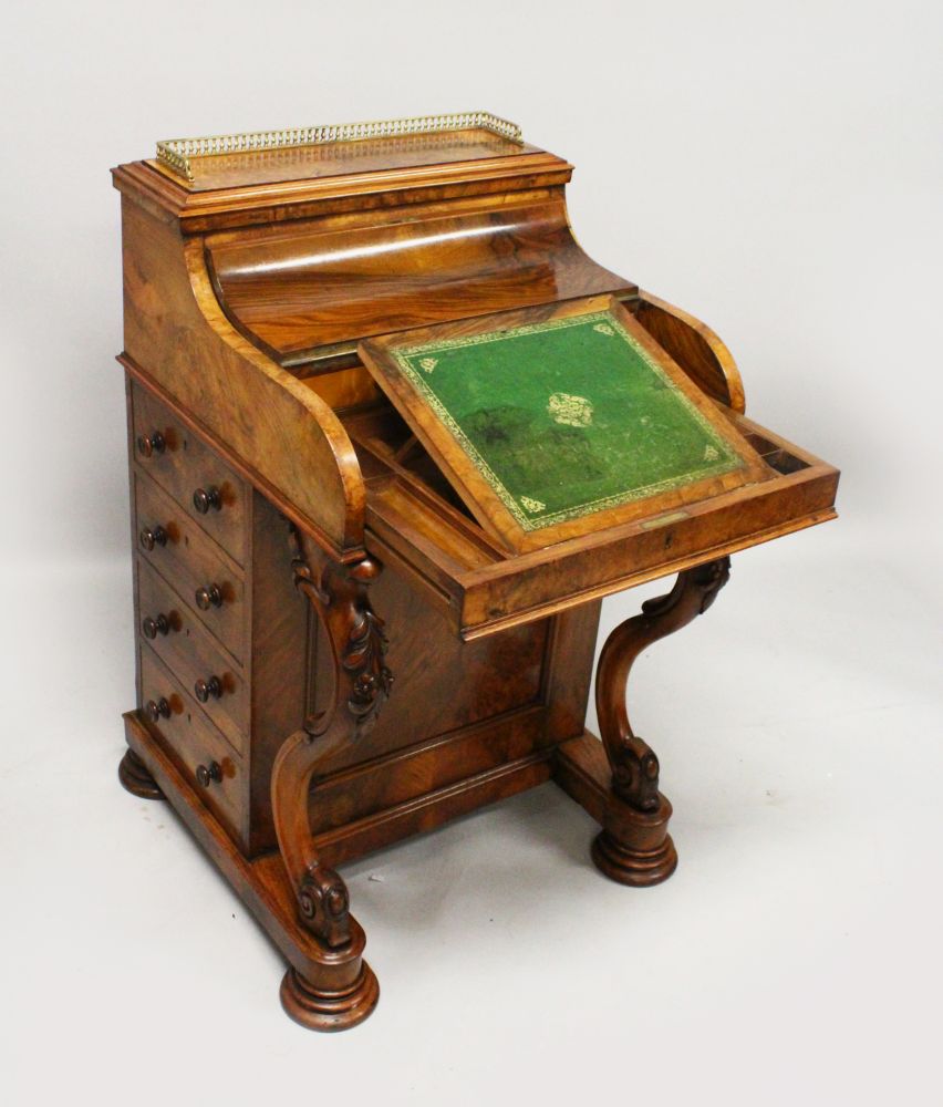 A GOOD VICTORIAN WALNUT PIANO TOP DAVENPORT, with brass grill, rising and sliding fitted top, four