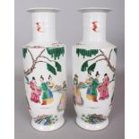 A MIRROR PAIR OF CHINESE YONGZHENG STYLE FAMILLE ROSE PORCELAIN ROULEAU VASES, each decorated with a