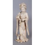 A FINE QUALITY SIGNED JAPANESE MEIJI PERIOD IVORY OKIMONO OF A STANDING LADY, holding a box, a