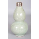 A 20TH CENTURY ORIENTAL CELADON GLAZED DOUBLE GOURD PORCELAIN VASE, with a silver-metal rim and