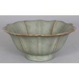 A CHINESE SONG STYLE CELADON GLAZED PORCELAIN LOTUS BOWL, the base with three spur marks, 6.2in
