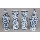 A GARNITURE OF FOUR 19TH CENTURY CHINESE BLUE & WHITE PORCELAIN VASES, two with covers, each painted