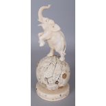 A GOOD JAPANESE MEIJI PERIOD SECTIONAL SHIBAYAMA & IVORY OKIMONO OF AN ELEPHANT STANDING ON A GLOBE,