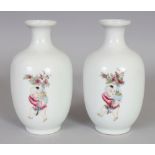 A PAIR OF GOOD QUALITY CHINESE FAMILLE ROSE PORCELAIN VASES, each vase painted with three boys