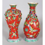 AN 18TH CENTURY CHINESE CLOBBERED & MOULDED SOFT PASTE RED GROUND PORCELAIN VASE, the shoulders