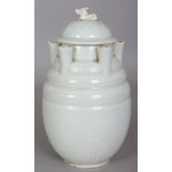 A CHINESE SONG STYLE PORCELAIN FUNERARY VASE & COVER, applied with a pale celadon glaze, the base