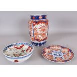 AN EARLY 20TH CENTURY JAPANESE IMARI FLUTED PORCELAIN VASE, 10in high; together with an Imari plate,