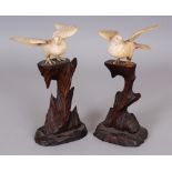 A PAIR OF JAPANESE MEIJI PERIOD SECTIONAL BONE CARVINGS OF WOOD PIGEONS, each perched on a tall