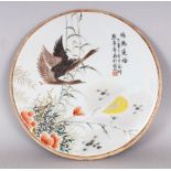 A CHINESE REPUBLIC STYLE CIRCULAR PORCELAIN PLAQUE, decorated with geese in flight above ferns, 10.