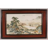A CHINESE REPUBLIC STYLE WOOD FRAMED PORCELAIN PLAQUE, decorated with calligraphy and with an
