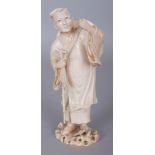 A GOOD QUALITY SIGNED MEIJI PERIOD IVORY OKIMONO OF A TRAVELLER, holding a staff, a toad at his