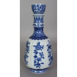 A CHINESE MING STYLE BLUE & WHITE PORCELAIN GUGLET, with fluted sides and a cup-form mouth, the base