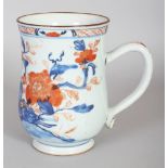 AN 18TH CENTURY CHINESE IMARI PORCELAIN TANKARD, painted with a fenced garden scene of peony, 5.