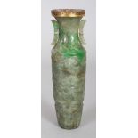 A GOOD QUALITY 19TH/20TH CENTURY JADE VASE, the sides carved with taotie masks between lappet and