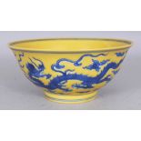 A CHINESE YELLOW GROUND BLUE & WHITE PORCELAIN DRAGON BOWL, the base with a six-character