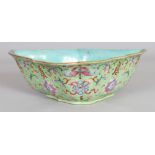A CHINESE DAOGUANG PERIOD LIME-GREEN GROUND FAMILLE ROSE SHAPED PORCELAIN BOWL, painted with Shou