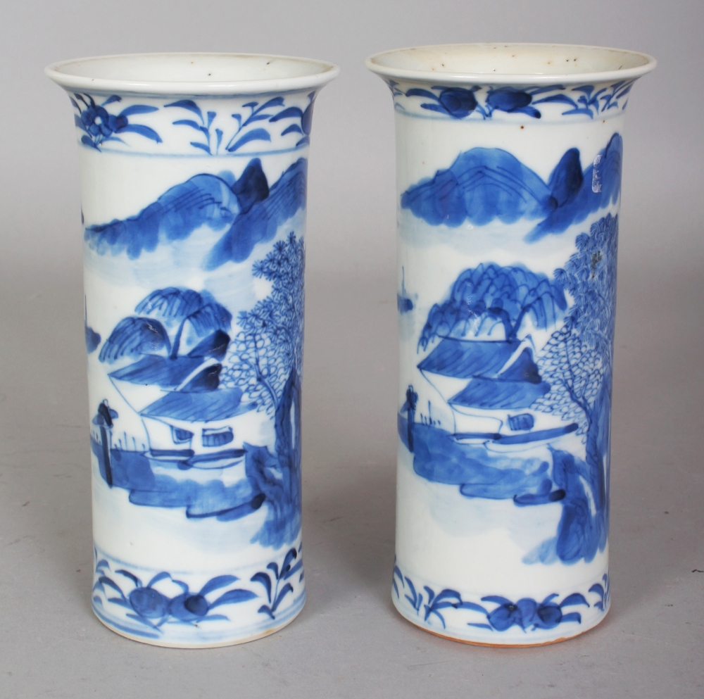 A PAIR OF 19TH CENTURY CHINESE BLUE & WHITE RIVER LANDSCAPE CYLINDRICAL PORCELAIN VASES, each base