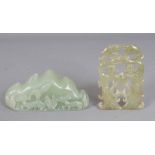 A SMALL CHINESE CELADON JADE MOUNTAIN BRUSH REST, 3.75in wide & 1.8in high; together with a