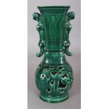 A CHINESE MING STYLE GREEN GLAZED PIERCED CERAMIC VASE, the base with an archaic three-character