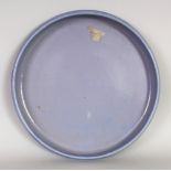 AN UNUSUAL 20TH CENTURY CHINESE BLUE GLAZED SHALLOW BOWL, the unglazed base impressed with a seal