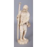A GOOD QUALITY SIGNED MEIJI PERIOD IVORY OKIMONO OF A FISHERMAN, holding a long oar in one hand