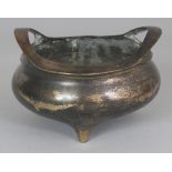 A CHINESE BRONZE TRIPOD CENSER, weighing 700gm, the base cast with a seal mark, 6.1in wide at widest