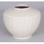 A CHINESE SONG STYLE MOULDED LOTUS JAR, applied with a pale celadon glaze, 5.25in wide at widest