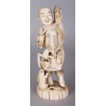 A SIGNED JAPANESE MEIJI PERIOD IVORY OKIMONO OF A FARMER, holding a tetsubin and a scythe, and in