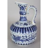 A CHINESE MING STYLE BLUE & WHITE PORCELAIN PHOENIX EWER, the base with a faint underglaze incised