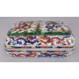 A CHINESE WANLI STYLE WUCAI PORCELAIN DRAGON BOX & COVER, of rectangular form with indented corners,