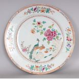 AN 18TH CENTURY CHINESE QIANLONG PERIOD FAMILLE ROSE DOUBLE PEACOCK CHARGER, 15in diameter.