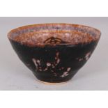 A CHINESE SONG STYLE PAPERCUT CERAMIC BOWL, the base unglazed, 4.6in diameter at rim & 2.4in high.