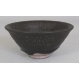 A CHINESE SONG STYLE JIAN WARE BLACK GLAZED CERAMIC BOWL, the glaze falling short of the foot, 4.9in