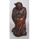 AN EARLY 20TH CENTURY JAPANESE BIZEN TYPE CERAMIC FIGURE OF DARUMA, standing in a hooded robe, 13.