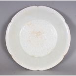 A CHINESE SONG STYLE QINGBAI PETAL LOBED PORCELAIN BOWL, the centre moulded beneath the glaze with