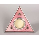 A RARE RUSSIAN FABERGE DESIGN PINK ENAMEL TRIANGULAR FRAME, set with seed pearls and cabochon