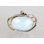 A large silver and cut moonstone ring.