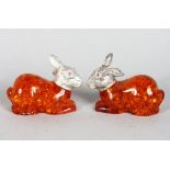 A PAIR OF AMBER STYLE RABBITS