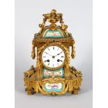 A 19TH CENTURY LOUIS XVI STYLE ORMOLU CLOCK, with painted Serves style panels, circular dial, urn